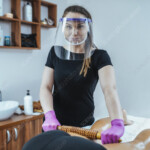 Madero Massage Therapist Wearing PPE Stock Image F035 0608